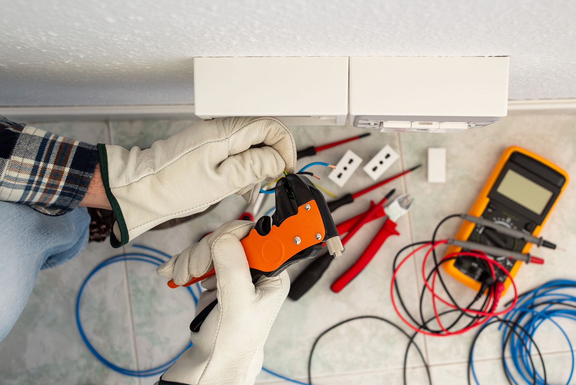 Electrician at work on a residential electrical system. Electricity.